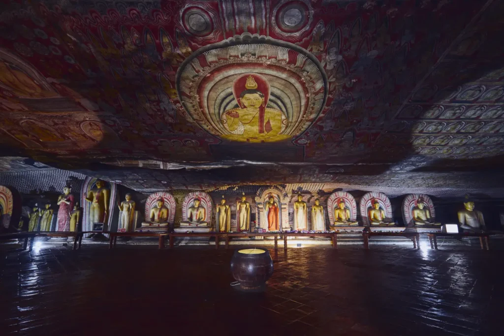 The interior of the Dambulla Cave Temple, a UNESCO World Heritage Site, with many statues of Buddha, a highlight of tours provided by a top Tour Company in Sri Lanka and expert Tour Operators in Sri Lanka.