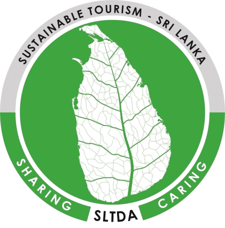 A circular logo featuring a leaf-patterned map of Sri Lanka inside a green circle with the words "Sustainable Tourism - Sri Lanka", "Sharing", "Caring", and "SLTDA".